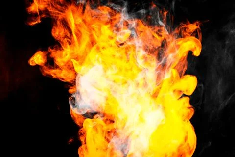 Fire flames background. Cloud of  fiery smoke on a black isolated background. Stock Photos
