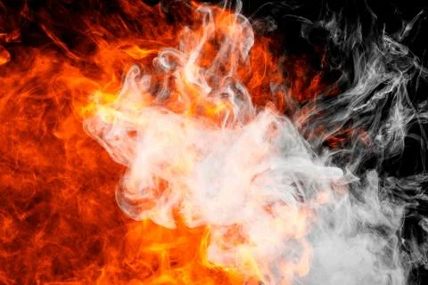 Fire flames background. Cloud of  fiery smoke on a black isolated background. Stock Photos