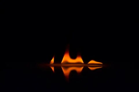 Fire flames on a  background Stock Photos