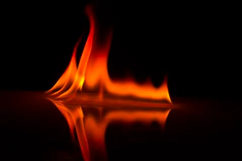 Fire flames on a  background Stock Photos