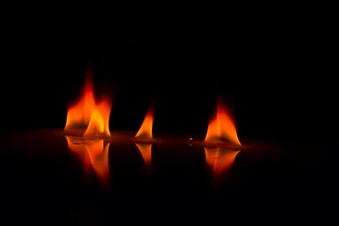 Fire flames on a  background Stock Photos