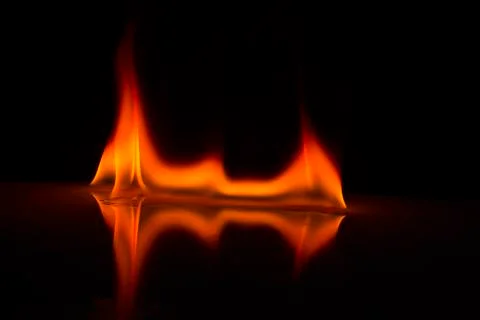 Fire flames on a  background Stock Photos