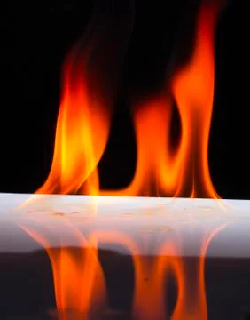 Fire flames on a  background Stock Photos