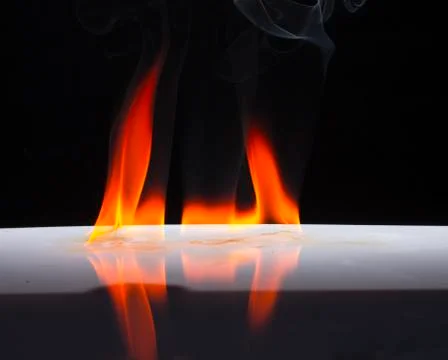 Fire flames on a  background Stock Photos