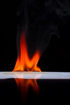 Fire flames on a  background Stock Photos