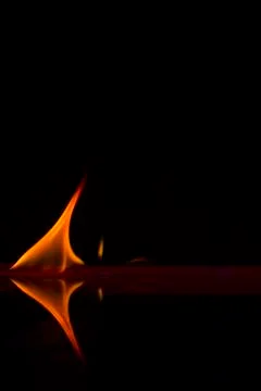 Fire flames on a  background Stock Photos