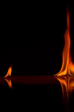 Fire flames on a  background Stock Photos