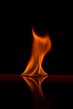 Fire flames on a  background Stock Photos