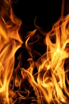 Fire flames on black backdrop. Fire texture. Blazing fire. Flame pattern Stock Photos