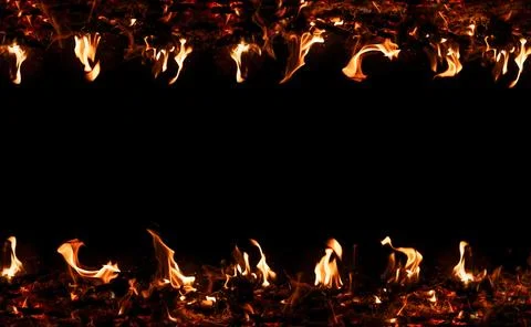 Fire flames on black background. Blazing campfire isolated on dark background Stock Photos