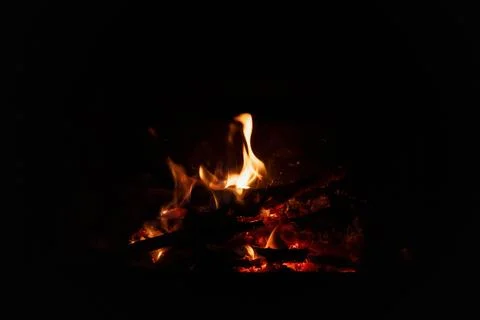 Fire flames on black background. Blazing campfire isolated on dark background Stock Photos