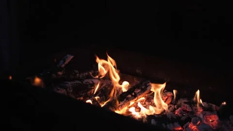 Fire flames on a black background, bright fire. Bonfire with fire and coals Stock Footage 252011293