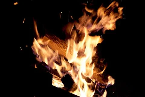 Fire flames on a black background. The fire burns on a black background. Stock Photos
