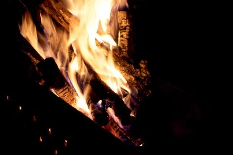 Fire flames on a black background. The fire burns on a black background. Stock Photos
