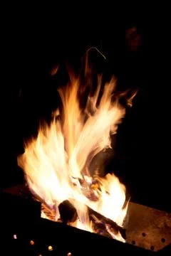Fire flames on a black background. The fire burns on a black background. Stock Photos