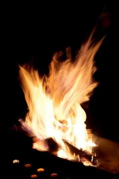 Fire flames on a black background. The fire burns on a black background. Stock Photos