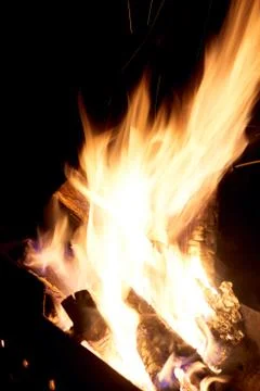 Fire flames on a black background. The fire burns on a black background. Stock Photos