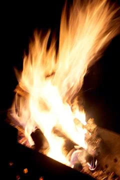 Fire flames on a black background. The fire burns on a black background. Stock Photos