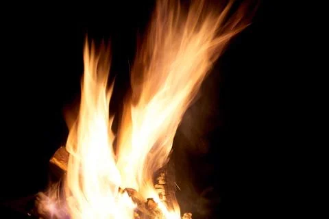 Fire flames on a black background. The fire burns on a black background. Stock Photos