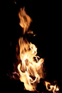 Fire flames on a black background. The fire burns on a black background. Stock Photos