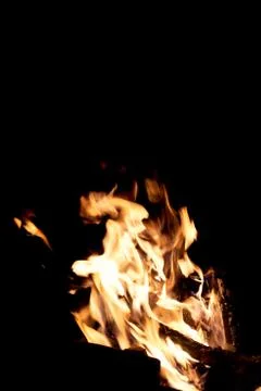 Fire flames on a black background. The fire burns on a black background. Stock Photos