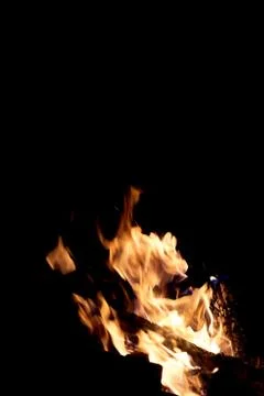 Fire flames on a black background. The fire burns on a black background. Stock Photos