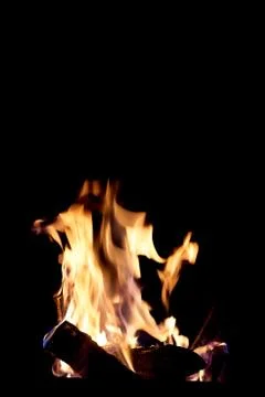 Fire flames on a black background. The fire burns on a black background. Stock Photos