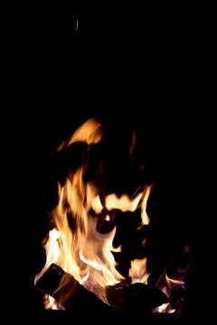 Fire flames on a black background. The fire burns on a black background. Stock Photos