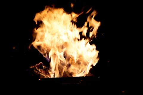Fire flames on a black background. The fire burns on a black background. Stock Photos