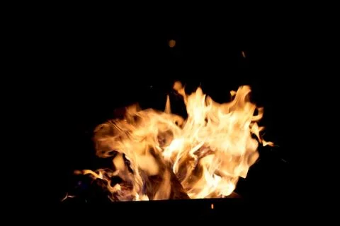 Fire flames on a black background. The fire burns on a black background. Stock Photos