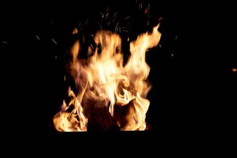 Fire flames on a black background. The fire burns on a black background. Stock Photos