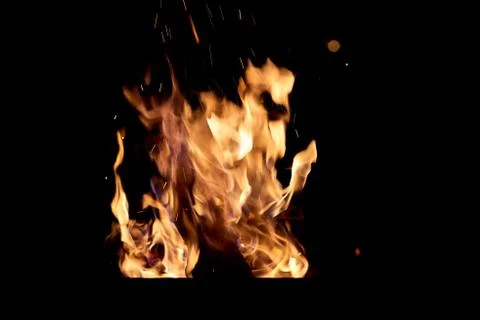 Fire flames on a black background. The fire burns on a black background. Stock Photos