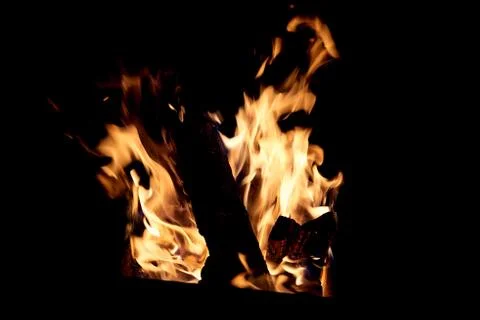 Fire flames on a black background. The fire burns on a black background. Stock Photos