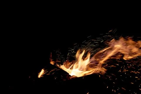 Fire flames on a black background. The fire burns on a black background. Stock Photos