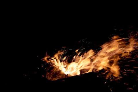Fire flames on a black background. The fire burns on a black background. Stock Photos