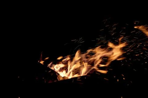 Fire flames on a black background. The fire burns on a black background. Stock Photos