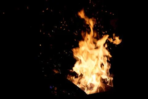 Fire flames on a black background. The fire burns on a black background. Stock Photos