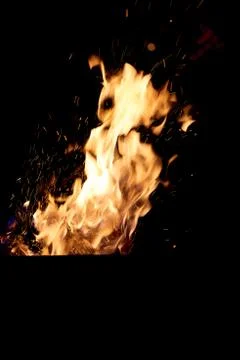 Fire flames on a black background. The fire burns on a black background. Stock Photos