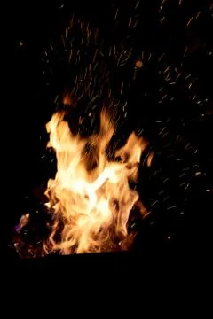Fire flames on a black background. The fire burns on a black background. Stock Photos