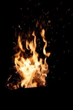 Fire flames on a black background. The fire burns on a black background. Stock Photos