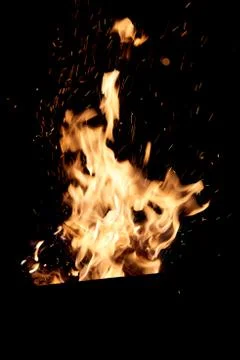 Fire flames on a black background. The fire burns on a black background. Stock Photos