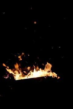 Fire flames on a black background. The fire burns on a black background. Stock Photos