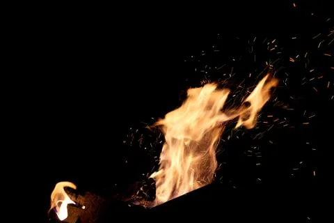 Fire flames on a black background. The fire burns on a black background. Stock Photos