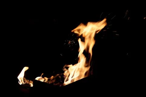 Fire flames on a black background. The fire burns on a black background. Stock Photos