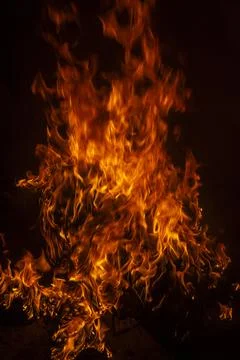 Fire flames on black background. Fire sparks background. Abstract dark fire f Stock Photos