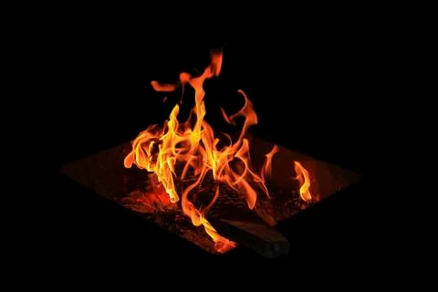 Fire flames on a black background Stock Photos