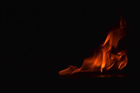 Fire flames on black background Stock Photos