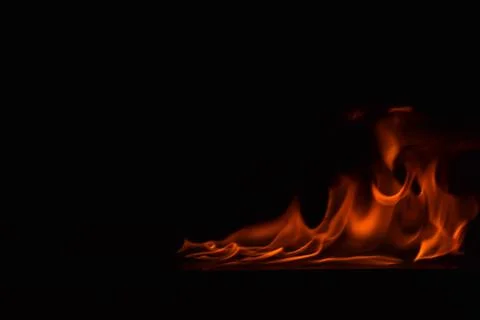 Fire flames on black background Stock Photos