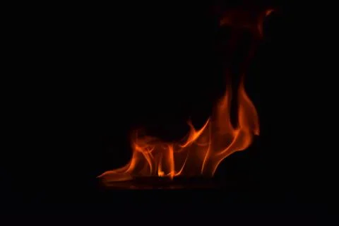 Fire flames on black background Stock Photos