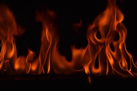 Fire flames on black background Stock Photos